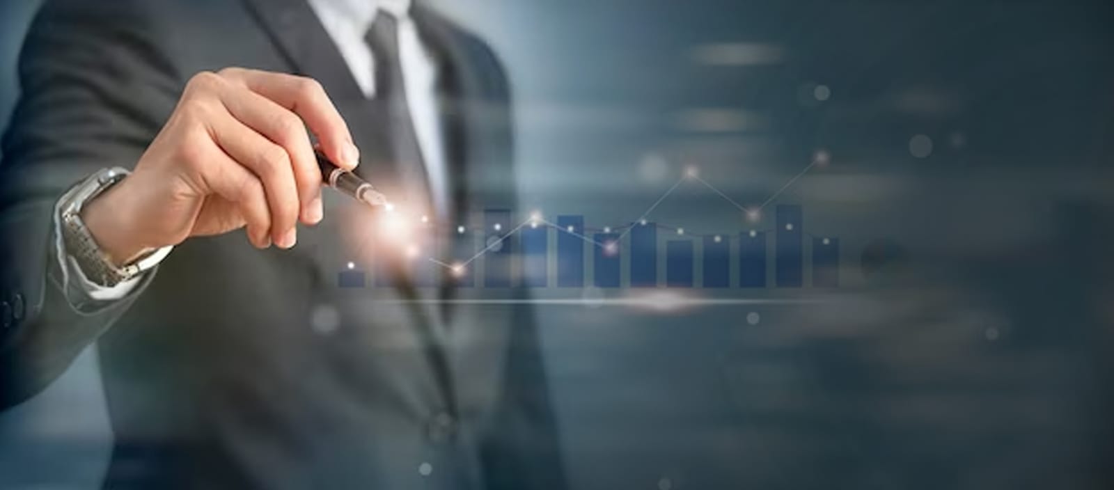 Businessman in a suit holding a pen and pointing to a rising bar and line chart overlay