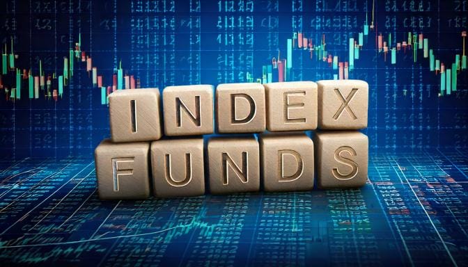 Wooden letter blocks spelling INDEX FUNDS stacked over a blue stock-market candlestick chart background.